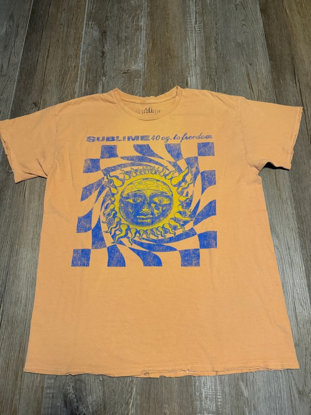 Sublime T-shirt featuring the 40oz to Freedom" sun graphic.